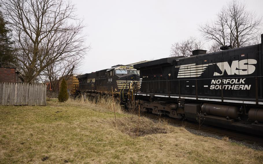 A Norfolk Southern train is en route on Feb. 14, 2023, in East Palestine, Ohio.