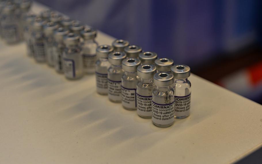 Emptied Pfizer/BioNTech COVID-19 booster vaccine ampoules are lined up during a vaccination bus event in Kaiserslautern, Germany, Nov. 30, 2021. 