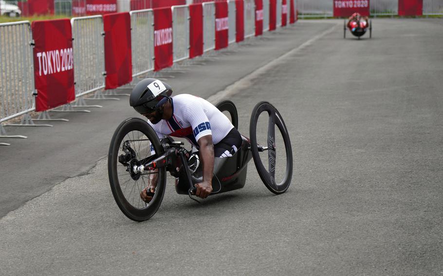 U.S. Army veteran Alfredo De los Santos rides a hand bike during a Paralympic time trial at Fuji International Speedway in Japan, Tuesday, Aug. 31, 2021             