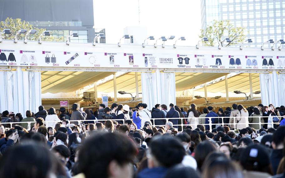 Taylor Swift fans line up to buy merchandise outside Tokyo Dome before the city's first Eras Tour concert, Wednesday, Feb. 7, 2024.
