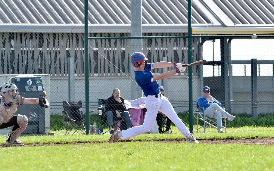 Ramstein right fielder James Arthaud hits the ball during the first game of a doubleheader against Wiesbaden on April 6, 2024, on Clay Kaserne in Wiesbaden, Germany.