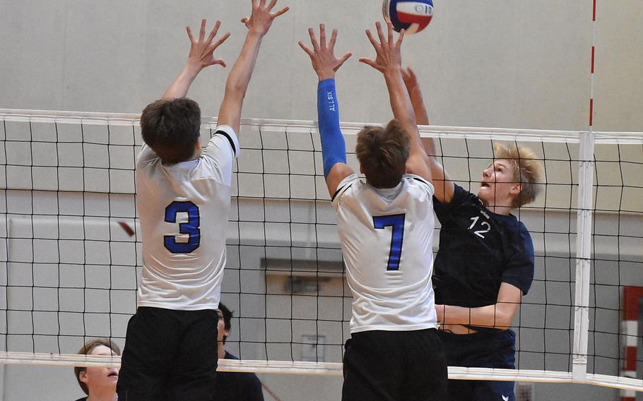 Black Forest Academy's Timothy Sivonen tries to get the ball past the Rota block of Hampton Brasfield, left, and Christian Weaver in the Falcons' semifinal victory on Friday, Oct. 28, 2022.

Kent Harris/Stars and Stripes