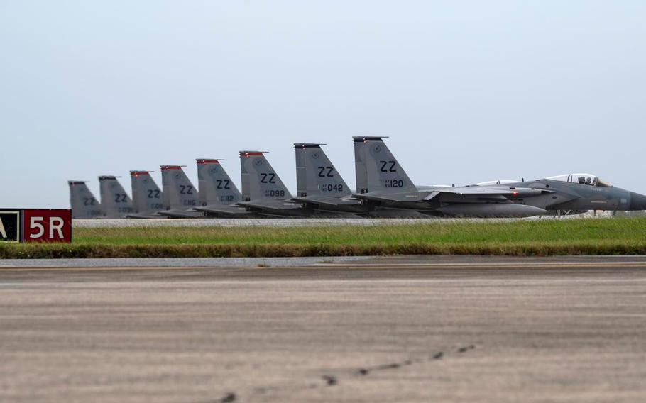 Air Force F-15C Eagles assigned to the 44th and 67th Fighter Squadrons await clearance for their last take-off from Kadena Air Base, Okinawa, Dec. 1, 2022. 