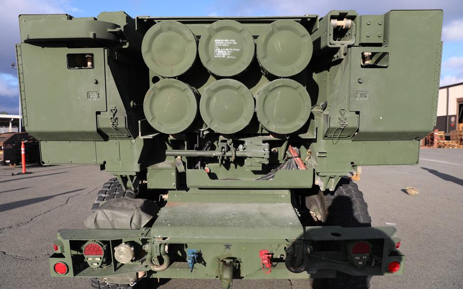 The back of a vehicle carrying a mounted High Mobility Artillery Rocket System or HIMARS.