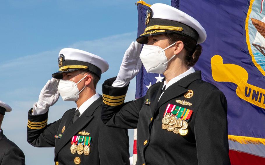 Navy Cmdr. Alexa Jenkins, right, attends a decommissioning ceremony at Naval Station Mayport, Fla., Feb. 18, 2021. 