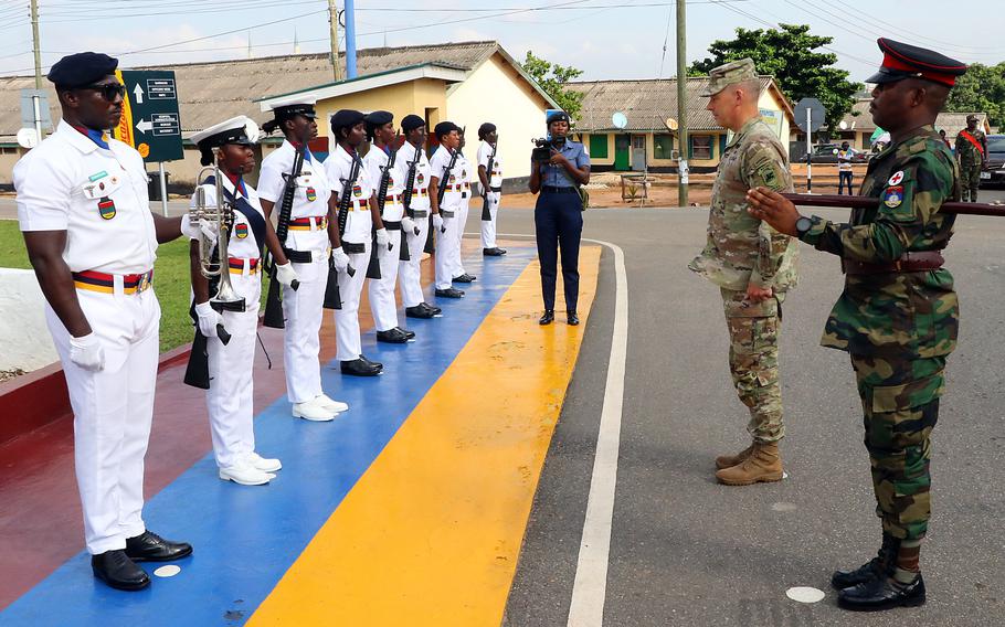 Maj. Gen. Todd Wasmund, commander of the Army's Southern European Task Force, Africa, is rendered honors during a visit to a medical center in Accra, Ghana, on June 14, 2023, as part of a joint medical exercise.