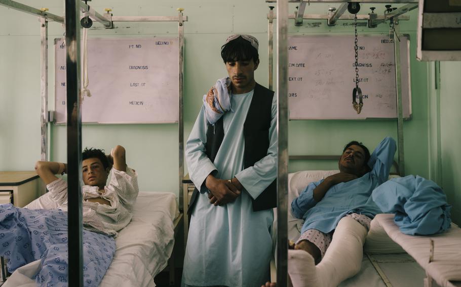 Policemen injured on the front lines recover in Kandahar’s main hospital on July 31, just two weeks before the Taliban took control of the country. 