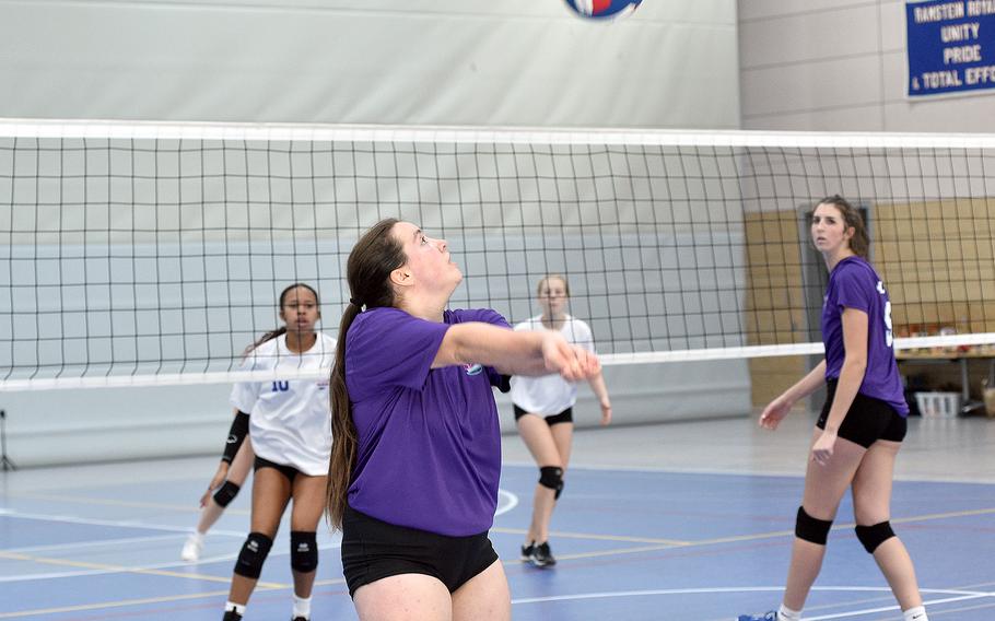Team Purple’s Sage Barnes of Kaiserslautern prepares to bump the ball Saturday during a DODEA-Europe all-star volleyball match at Ramstein High School on Ramstein Air Base, Germany. Team White’s Sophia Fisher, left, and Team Purple’s Lyndsey Urick follow along.