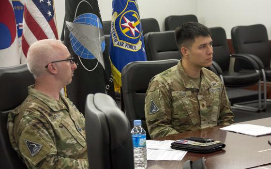 U.S. Space Forces Korea’s deputy commander, Maj. Charles Taylor, right, and Master Sgt. Shawn Stafford speak with reporters at Osan Air Base, South Korea, Wednesday, Aug. 30, 2023. 