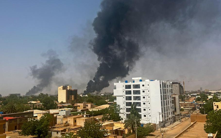 Smoke billows above residential buildings in Khartoum on April 16, 2023, as fighting in Sudan rages in battles between rival generals.