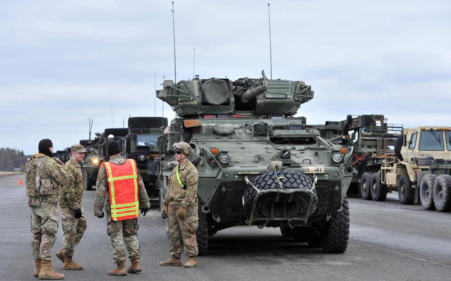 Soldiers of the 2nd Calvary Regiment get their Strykers and other combat support vehicles ready for a deployment to Romania at Vilseck Army Airfield, Germany, Feb. 9, 2022.