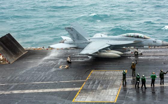 An F/A-18F Super Hornet from Strike Fighter Squadron 22 prepares to launch from the flight deck of the aircraft carrier USS Nimitz, Jan. 19, 2023, while on the South China Sea.
