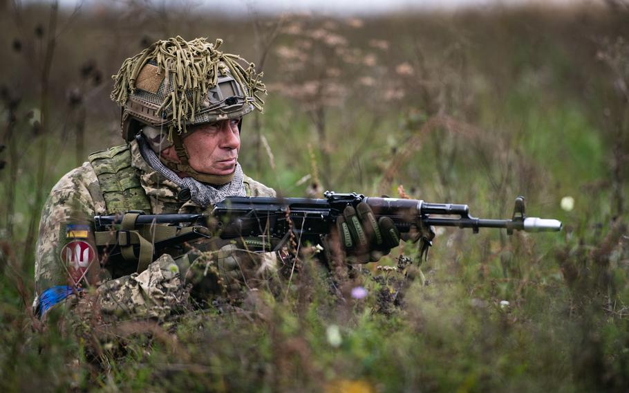 A Ukrainian paratrooper establishes sector security on a drop zone during an exercise with U.S. troops at a training center near Yavoriv, Ukraine, in September 2021. NATO Secretary-General Jens Stoltenberg on Nov. 15, 2021, condemned Russia’s troop buildup near Ukraine’s border.