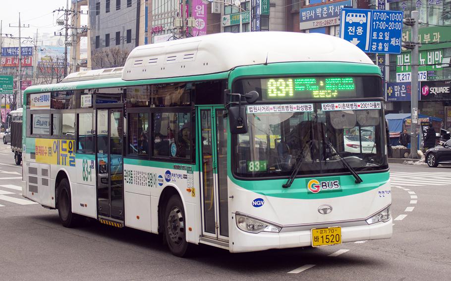 A bus makes its way through Suwon, South Korea, in February 2019. 