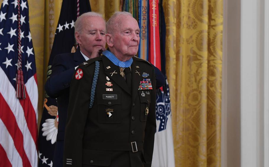 President Joe Biden presents the Medal of Honor to former Army Col. Ralph Puckett Jr. on May 21, 2021, during a ceremony at the White House. 