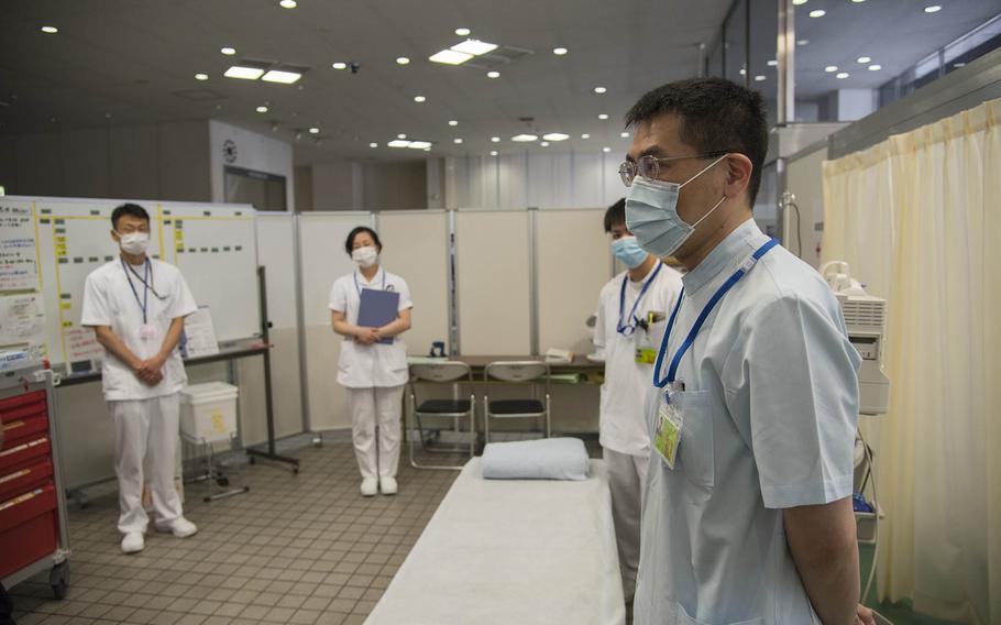 Medical workers prepare for a mass vaccination clinic sponsored by the Japan Ground Self-Defense Force earlier this month in Otemachi, Tokyo.