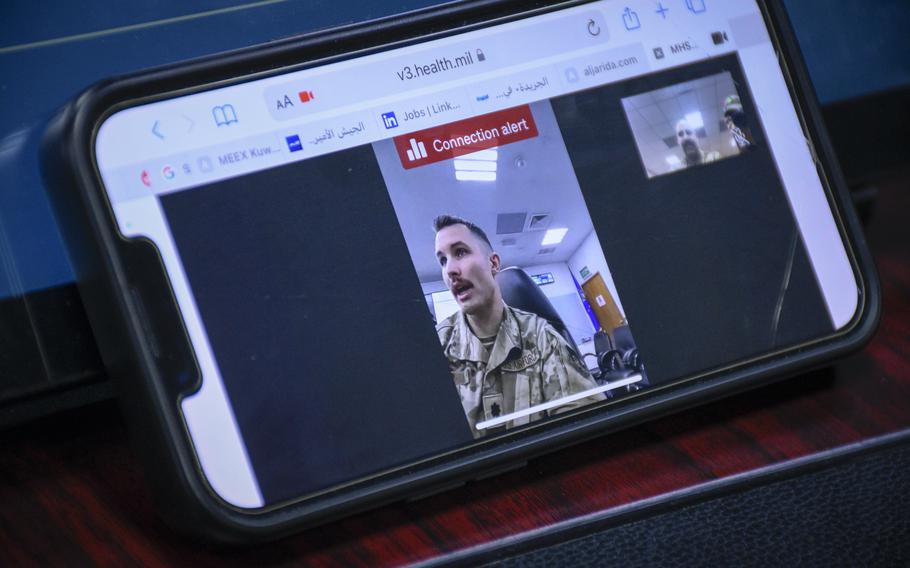 U.S. Air Force Lt. Col. David Tubman, 386th Expeditionary Medical Squadron clinical psychologist, speaks while using a video conferencing program at Ali Al Salem, Kuwait, on Nov. 26, 2022. He says the program will allow airmen to call mental health staff while deployed. 