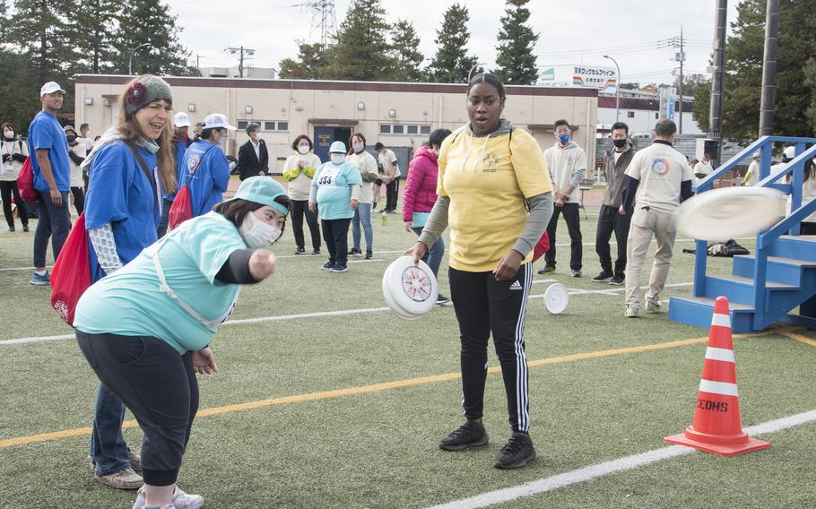 Jessica McKinstry, 23, of Tokyo, throws a disk during the Kanto Plains Special Olympics at Yokota Air Base, Japan, on Nov. 5, 2022.