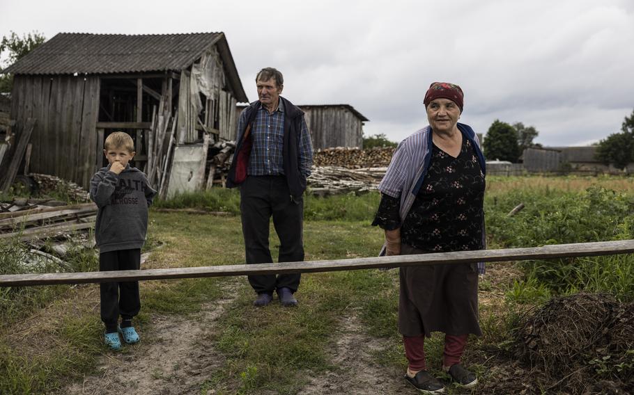 Members of the Dobrovec family in the yard of their home in the village of Kopyshche, Ukraine, on July 22, 2023. 