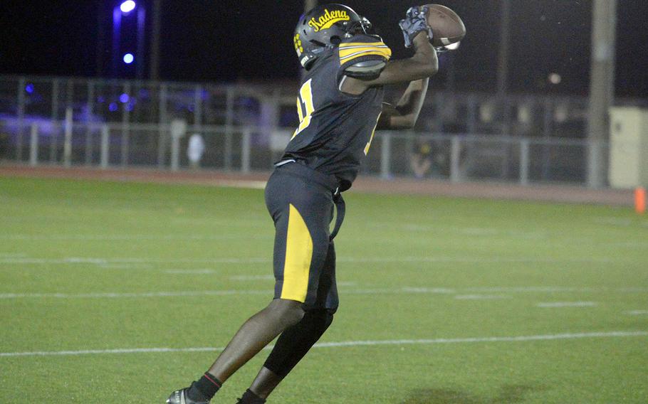 Kadena's Sadiiq Haynes comes down with the first of his two interceptions, which he returned 59 yards for a touchdown.