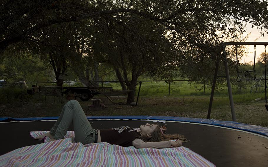 Evelyn Hill, 12, after jumping on the trampoline at her home in Sutherland Springs, Tex., on Sept. 9. 