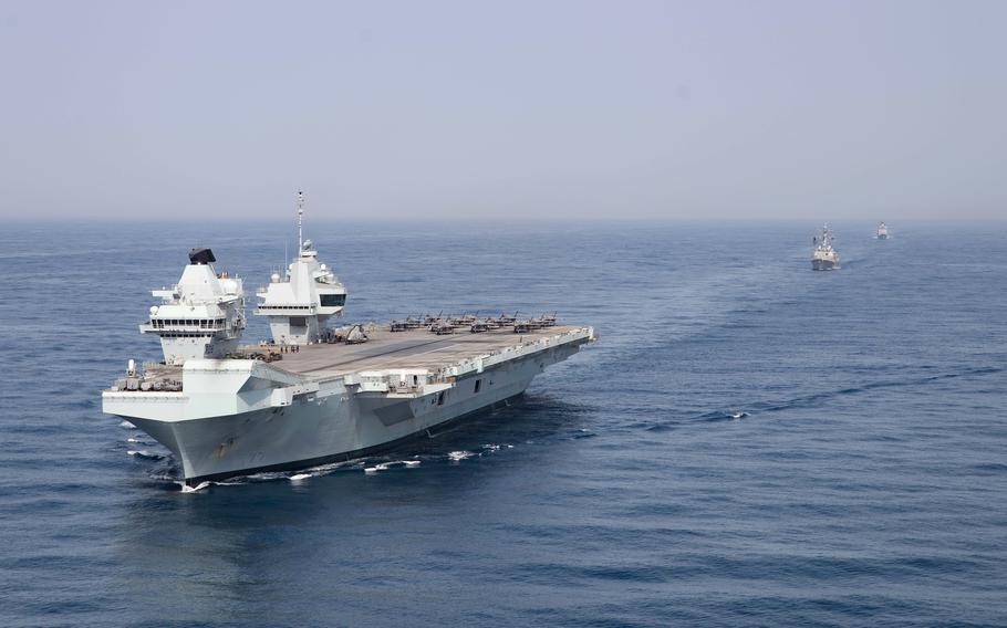 The Royal Navy aircraft carrier HMS Queen Elizabeth, guided-missile destroyer USS Halsey and guided-missile cruiser USS Shiloh sail in the Gulf of Aden, Monday, July 12, 2021. 