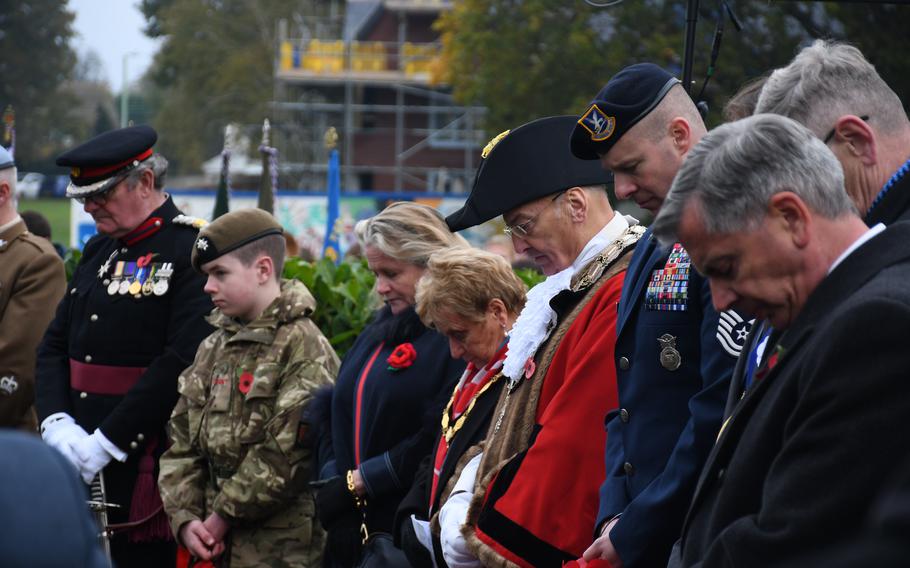 U.S. Air Force Chief Master Sgt. Jesse Frank bows his head alongside other dignitaries during a moment of silence during a Remembrance Day ceremony on Nov. 12, 2023, in Stowmarket, England.