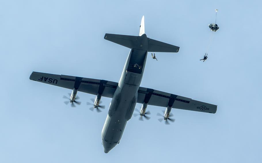 A C-130J Super Hercules from the Kentucky Air National Guard’s 123rd Airlift Wing airdrops six pararescuemen from 3,500 feet during the Thunder Over Louisville air show in Louisville, Ky., Saturday, April 20, 2024.