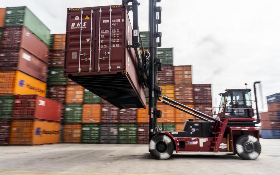 Containers are moved around at the Port of Los Angeles recently.