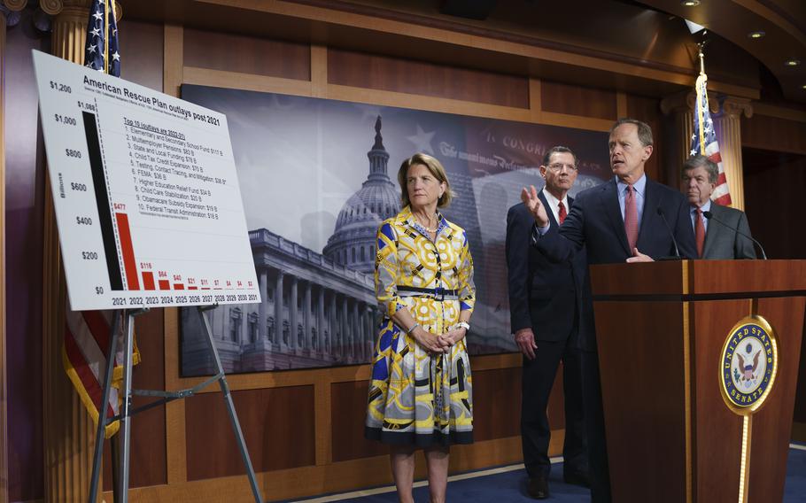 In this photo taken Thursday, May 27, 2021, Sen. Shelley Moore Capito, R-W.Va., the GOP's lead negotiator on a counteroffer to President Joe Biden's infrastructure plan, listens at left as she is joined at a news conference by, from left, Sen. John Barrasso, R-Wyo., Sen. Pat Toomey, R-Pa., chairman of the Senate Republican Conference, and Sen. Roy Blunt, R-Mo., at the Capitol in Washington. 