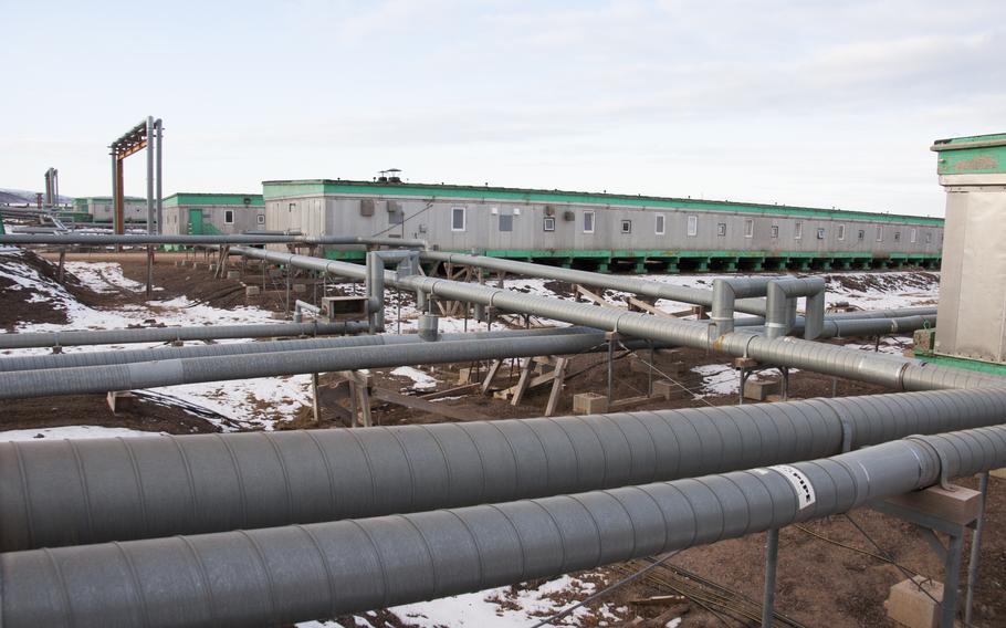 Connecting all the buildings on Thule are utility pipes that carry everything normally run underground. On the permafrost, buildings are put on pilings so the heat from them, or from running water, doesn’t destabilize the frozen ground and tilt the buildings.