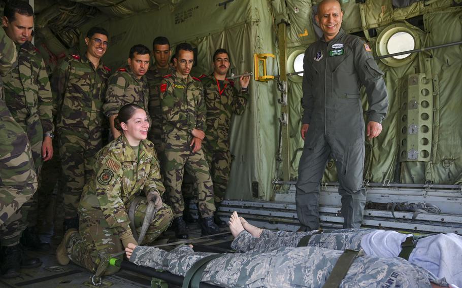 Air Force Staff Sgt. Chelsea Castro, assigned to the 349th Aeromedical Evacuation Squadron, and members of the Moroccan armed forces train together on aeromedical evacuations during exercise African Lion at Kenitra Air Base, Morocco, on May 24, 2024.