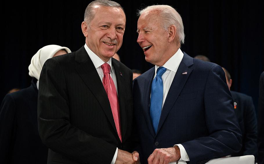 Turkey’s President Recep Tayyip Erdogan (left) and U.S. President Joe Biden shake hands at the start of the first plenary session of the NATO summit at the Ifema congress center in Madrid, on June 29, 2022.