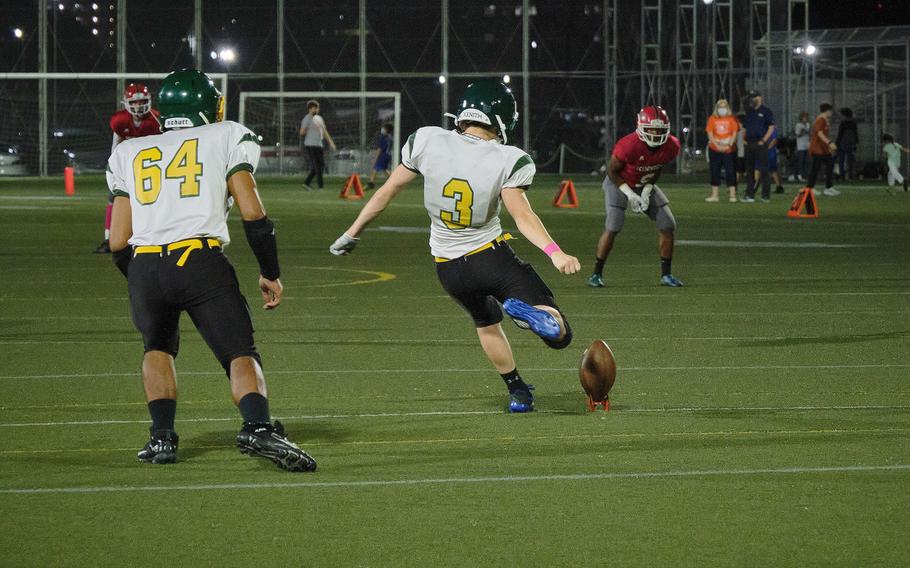 Robert D. Edgren's football team conducts a kickoff  to the Kinnick Red Devils during the second quarter.