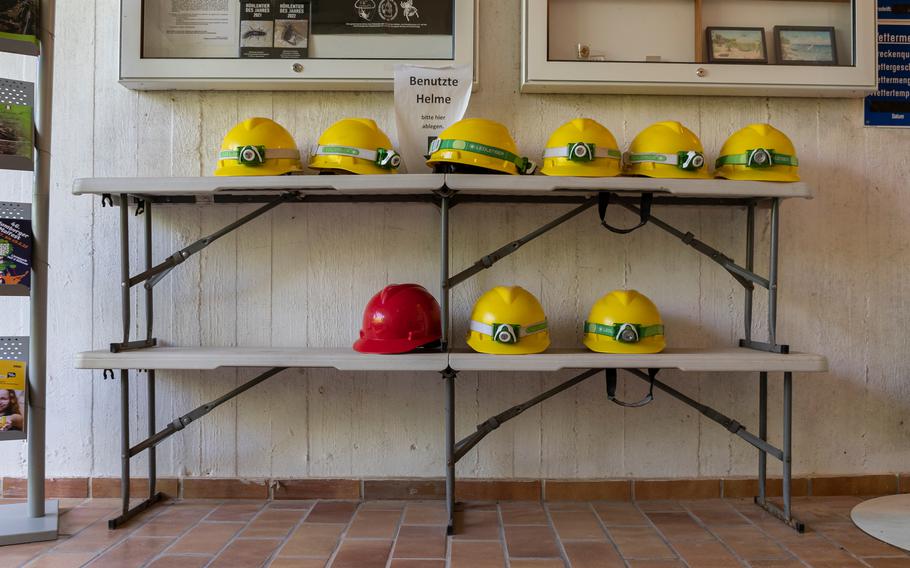 Hardhats are stored at the entrance of the Schlossberg Caves. They must be worn by visitors to the site as a safety precaution. Portions of the cave have been dated to the Triassic period.