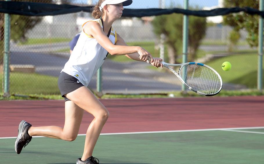 Megan Fife, Kadena's No. 6 tennis singles seed, hits a two-handed backhand against Kubasaki's Lillian Law during Wednesday's Okinawa tennis matches. Fife won 8-5.