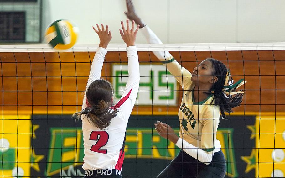 Robert D. Edgren's Elizabeth Johnson spikes past Nile C. Kinnick's Jillian Stevens during Saturday's Japan volleyball match. The Eagles won both matches this weekend in straight sets, improving to 18-0 this season. Johnson had 29 kills in 42 attempts in the two matches.