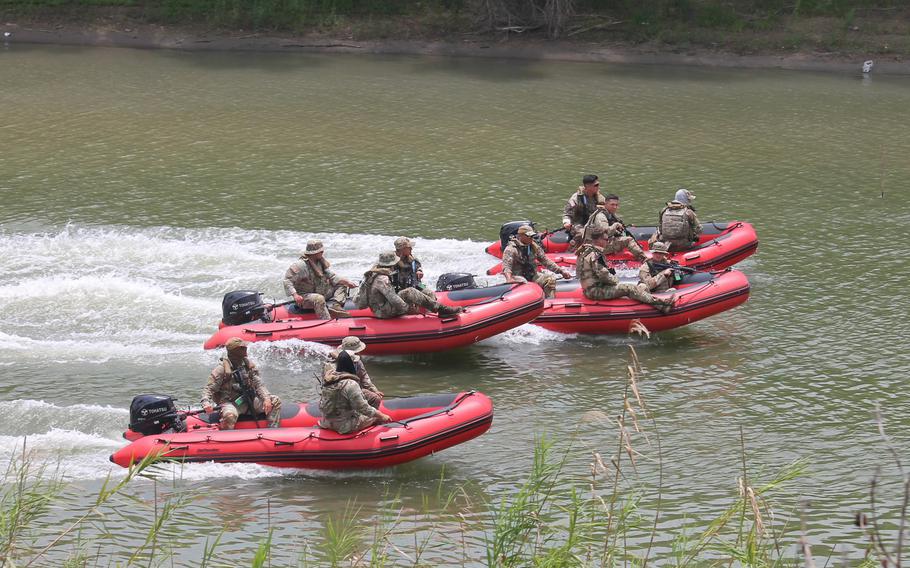 Members of the Texas National Guard patrol the Rio Grande to look for illegal activity along the state’s border with Mexico as part of the state-sponsored mission Operation Lone Star. 