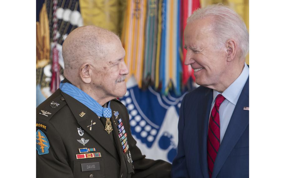 President Joe Biden congratulates retired Army Col. Paris Davis during a ceremony at the White House on Friday, March 3, 2023, moments after Biden presented Davis the Medal of Honor for his gallantry and heroic battle actions in Vietnam in 1965.