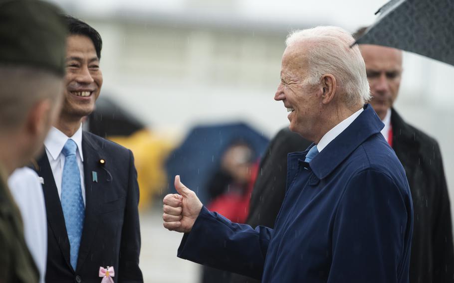 President Joe Biden greets base and local Japanese leaders after arriving at Marine Corps Air Station Iwakuni, Japan, Thursday, May 18, 2023.