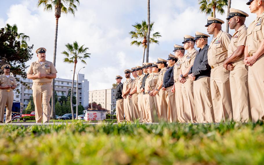 Sailors stand at attention