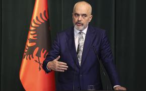 FILE - Albania's Prime Minister Edi Rama speaks during a press conference after a meeting with his Dutch counterpart Mark Rutte in Tirana, Albania, Wednesday, Nov. 10, 2021. Albania has offered NATO a naval base in an effort as a way to highlight the small country's value in the alliance “in these difficult times,” the prime minister's office said Thursday, May 26, 2022. (AP Photo/Franc Zhurda, File)