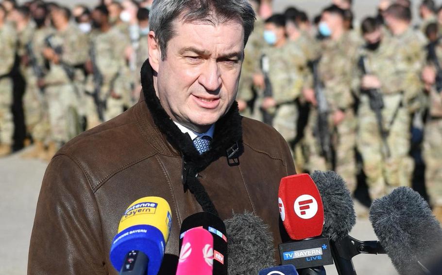 Bavarian governor Markus Soeder speaks to reporters after welcoming U.S. soldiers of 1st Armored Brigade Combat Team, 3rd Infantry Division, upon their arrival at the Nuremberg Airport, Germany, March 1, 2022.