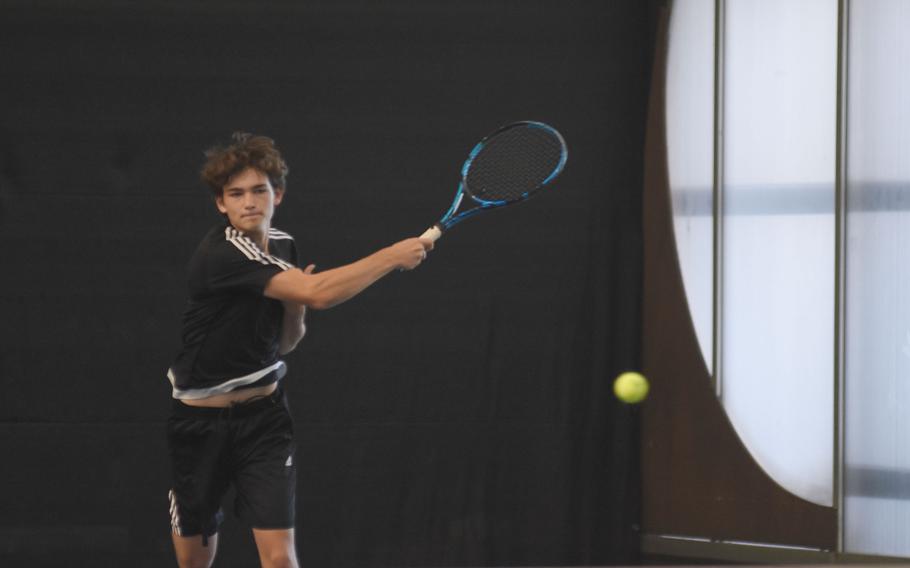 Stuttgart’s Noah Shive returns the ball during the finals for doubles at the DODEA European tennis championships on Saturday, Oct. 22, 2022, in Wiesbaden, Germany. Shive and teammate Zachary Call went undefeated this season en route to winning their first doubles title.