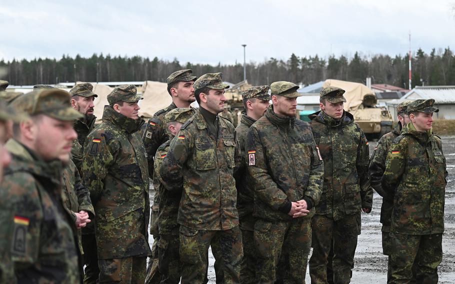 Candidates from the German Army NCO School listen to a discussion about U.S. military equipment during an exchange with soldiers from 1st Battalion, 37th Armored Regiment, in Grafenwoehr, Germany, on Feb. 22, 2024. The German military is planning a series of deployments to the Pacific this summer, and is looking at possibly setting up a permanent military liaison position in Hawaii at U.S. Indo-Pacific Command as it refines its regional strategy.