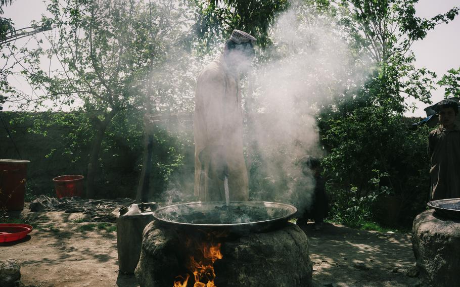 Chemicals are boiled together with ephedra powder in order to produce methamphetamine in Farah province, Afghanistan, on March 19.