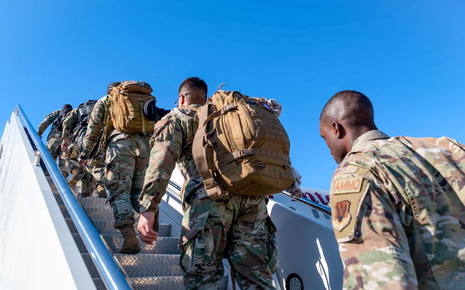 Airmen board an aircraft at Shaw Air Force Base, S.C., Oct. 15, 2022. The Air Force is rolling out a new cycle for the service that will move away from individual deployments in favor of team deployments.