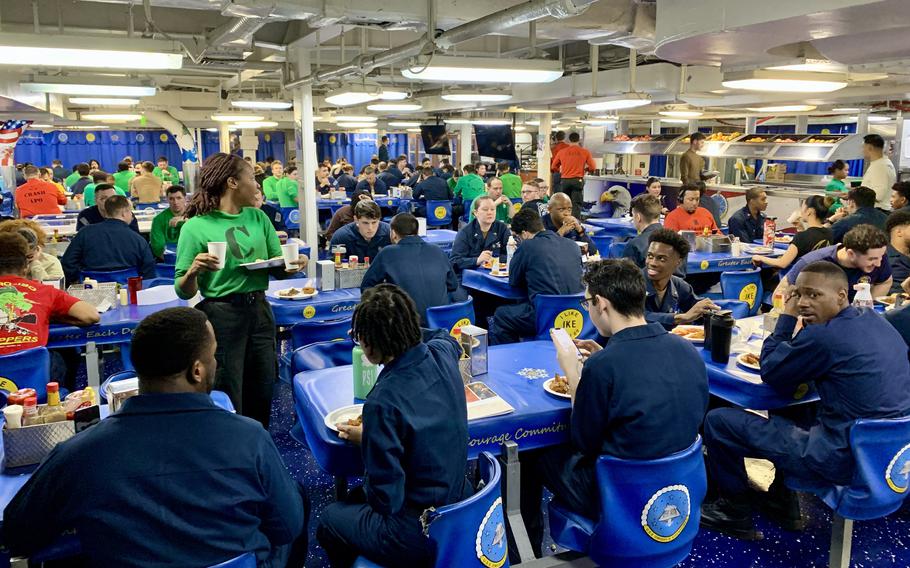 Sailors assigned to the aircraft carrier USS Dwight D. Eisenhower eat lunch in one of the ship's messes March 20, 2024. The sailors, who deployed from Norfolk, Va., in October, have been at sea for nearly five months without a port call. 