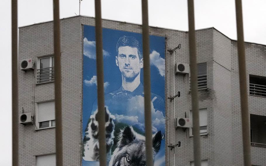 A billboard depicting Serbian tennis player Novak Djokovic hangs on a building in Belgrade, Serbia, Thursday, Jan. 6, 2022.