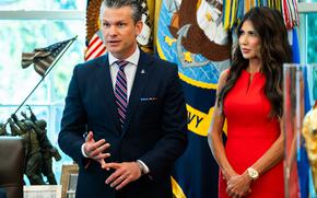 Defense Secretary Pete Hegseth and Homeland Security Secretary Kristi L. Noem stand together in the Oval Office.